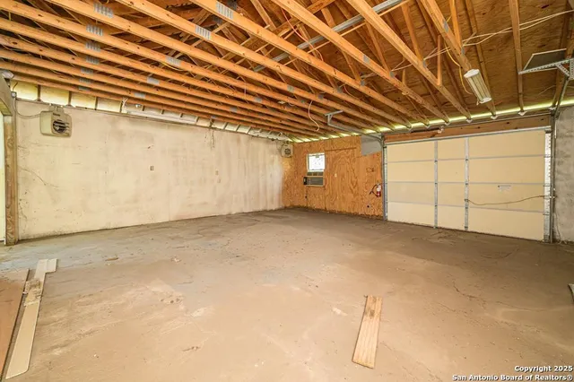 an aerial view of residential houses with outdoor space and garden
