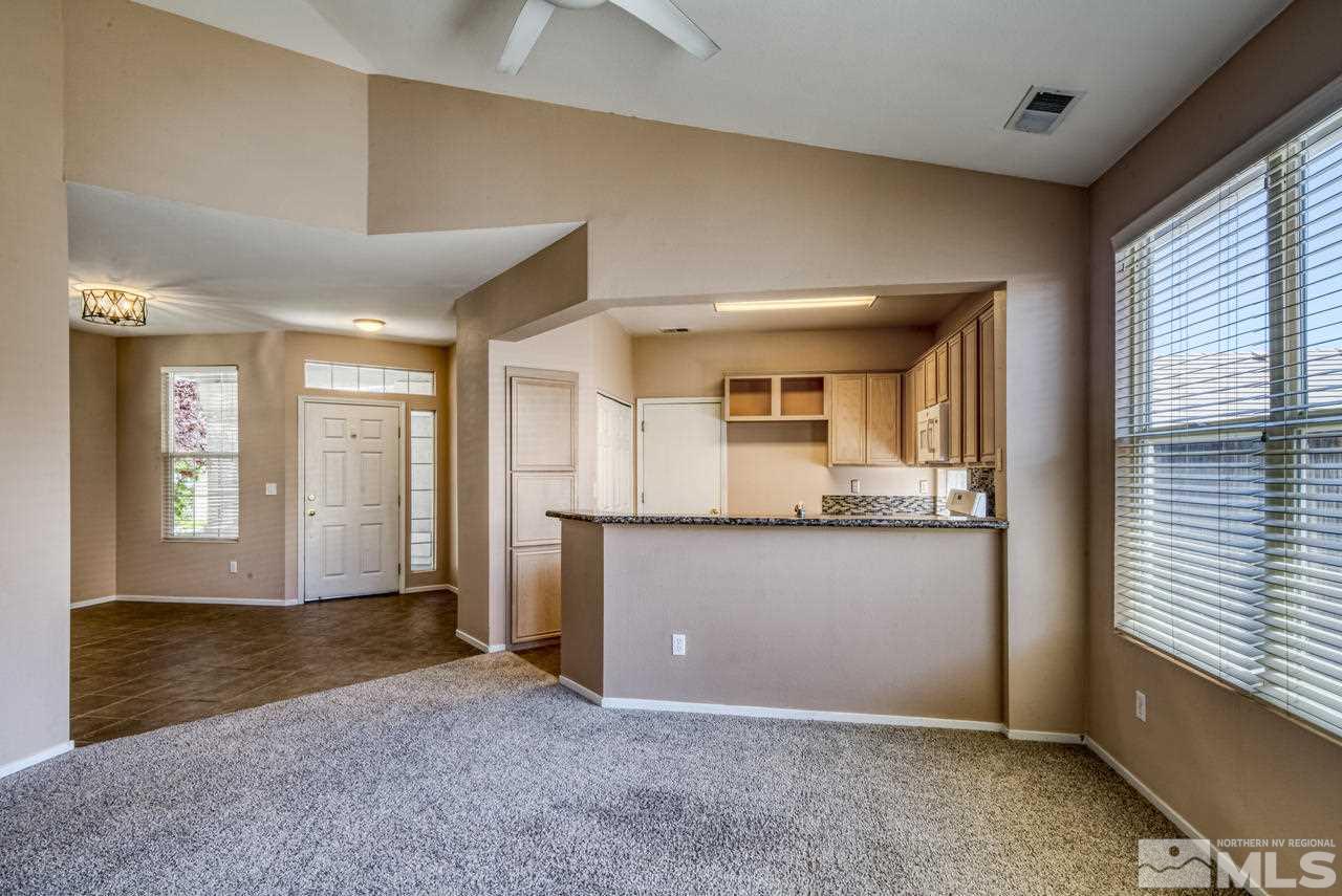 9683 Truckee Meadows Place Reno, NV 89521 - Photo 19 of 33 a view of kitchen with granite countertop cabinets and sink
