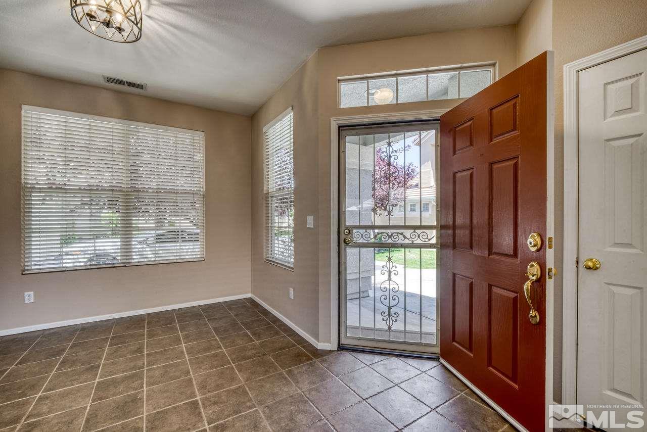 9683 Truckee Meadows Place Reno, NV 89521 - Photo 2 of 33 a view of an empty room with a window