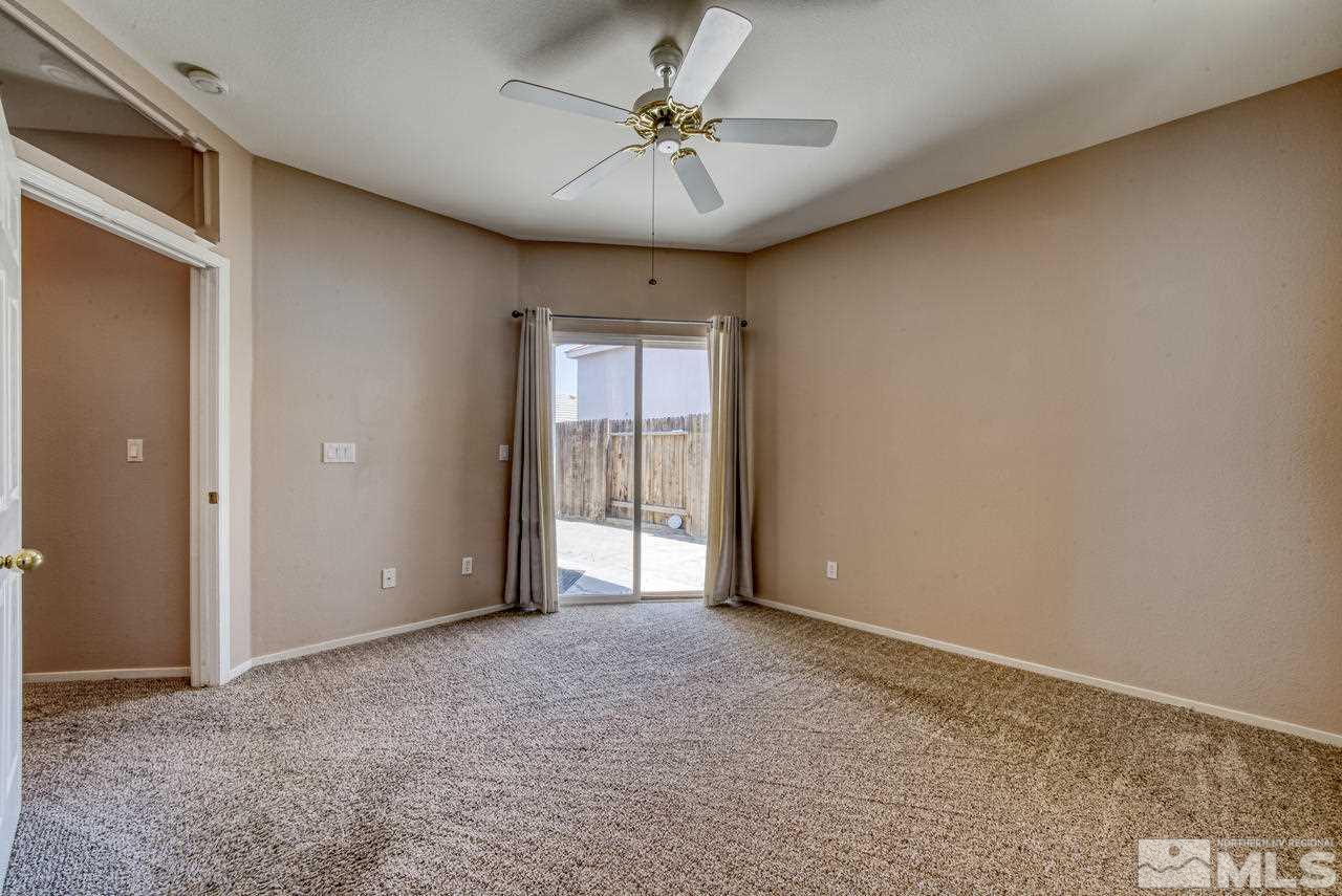 9683 Truckee Meadows Place Reno, NV 89521 - Photo 27 of 33 a view of an empty room with a window