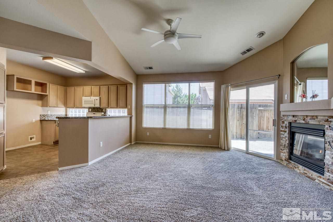 9683 Truckee Meadows Place Reno, NV 89521 - Photo 3 of 33 a view of a kitchen with a sink and a fireplace