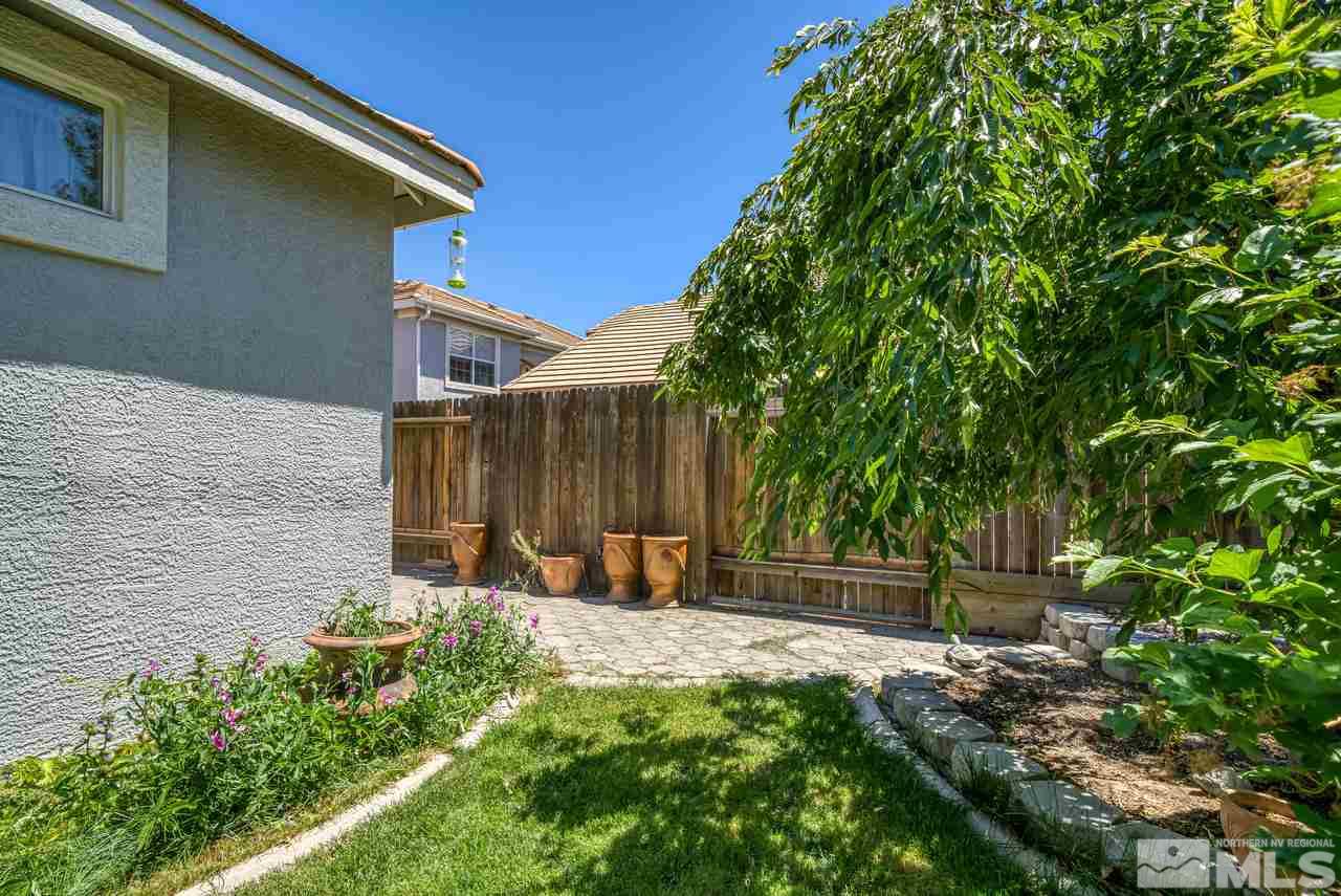 9683 Truckee Meadows Place Reno, NV 89521 - Photo 31 of 33 a backyard of a house with lots of green space