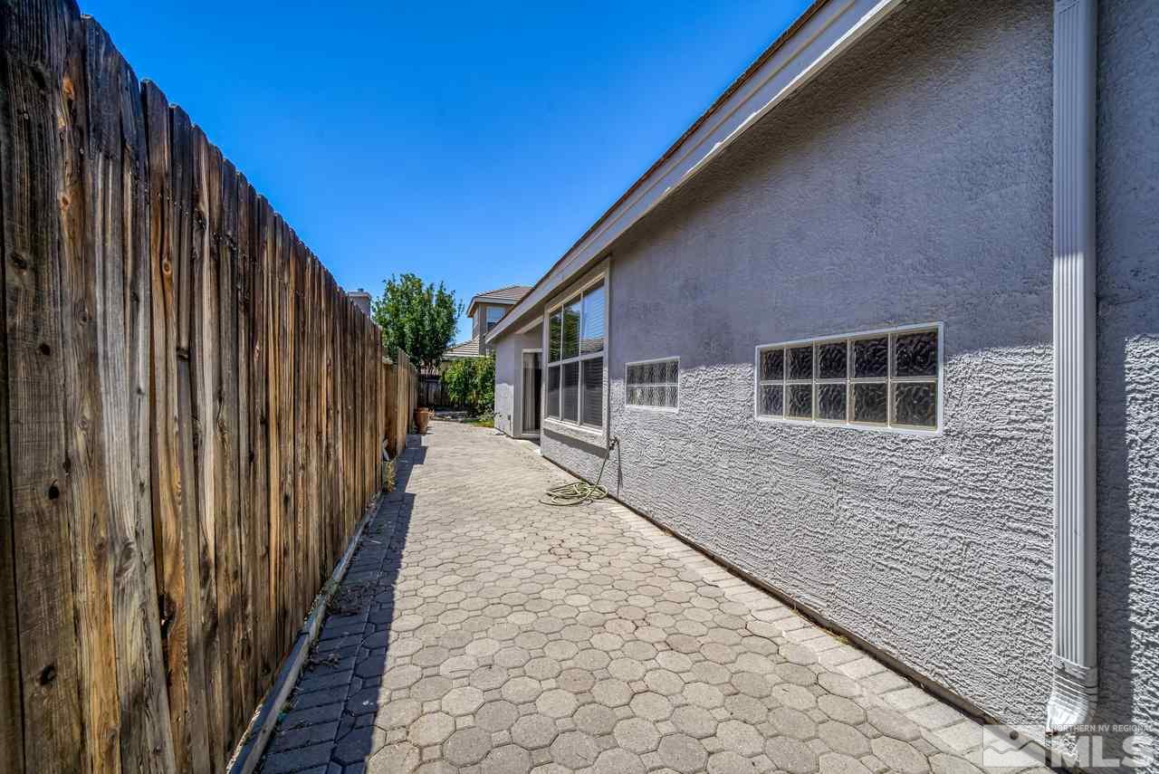 9683 Truckee Meadows Place Reno, NV 89521 - Photo 32 of 33 a view of a house with a backyard
