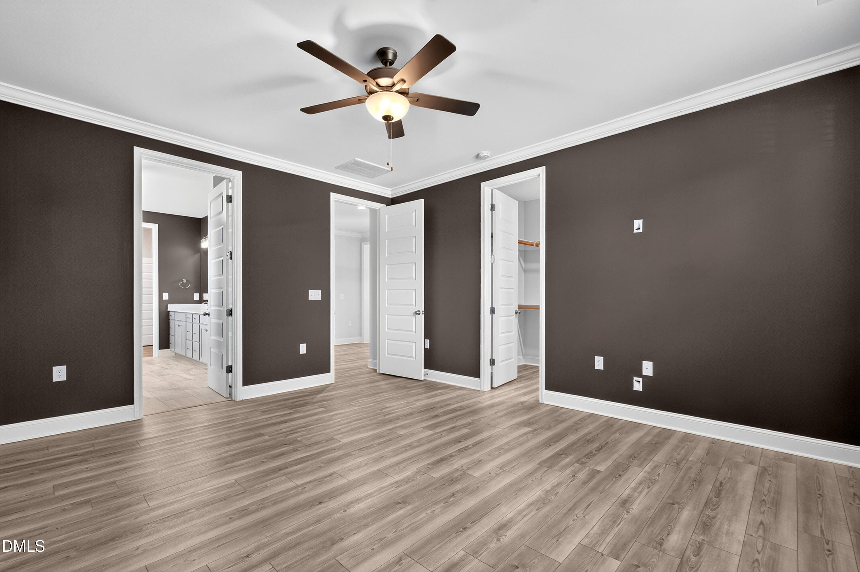1300 Commons Ford Place Apex, NC 27539 - Photo 29 of 70 a view of an empty room with wooden floor and a ceiling fan