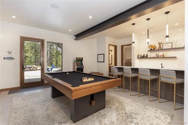 a living room with furniture a rug and a window