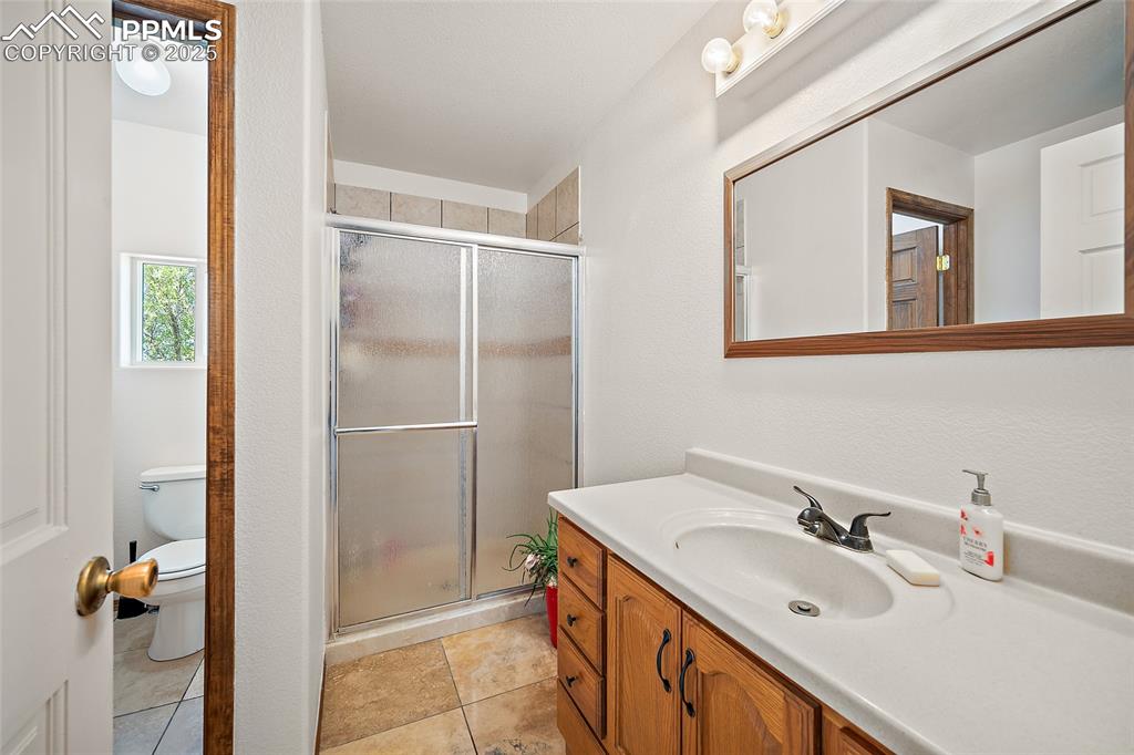5335 Whittemore Road Rush, CO 80833 - Photo 23 of 49 a bathroom with a sink and a mirror