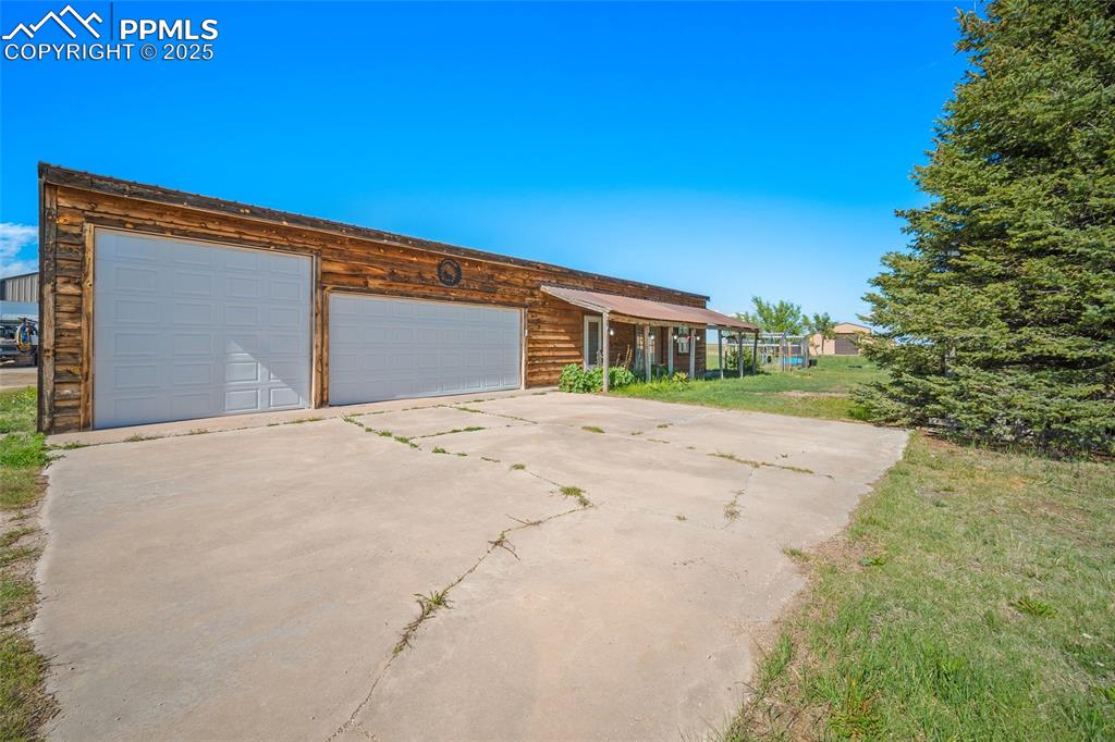 5335 Whittemore Road Rush, CO 80833 - Photo 42 of 49 a front view of a house with a yard