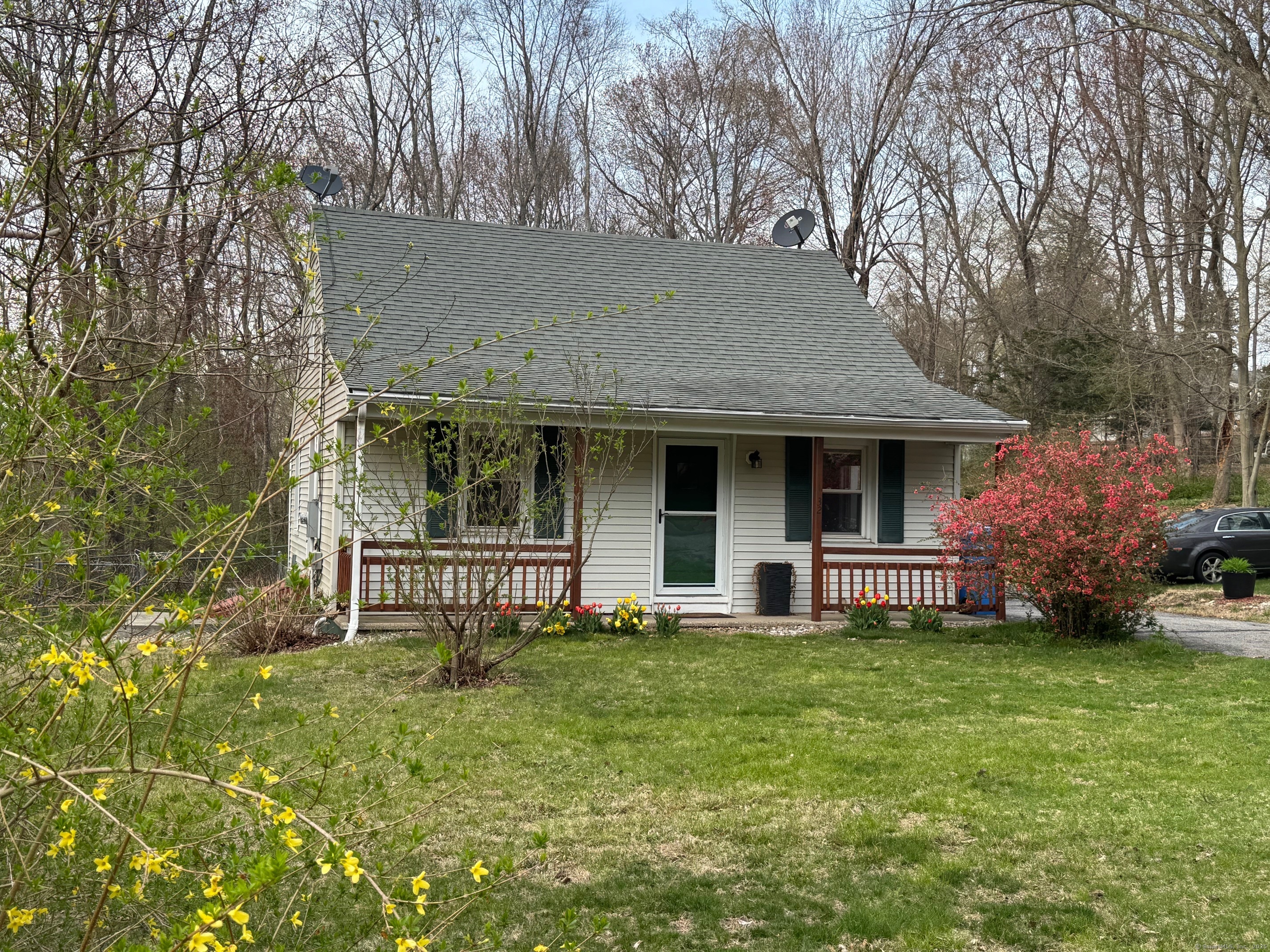 a front view of a house with garden