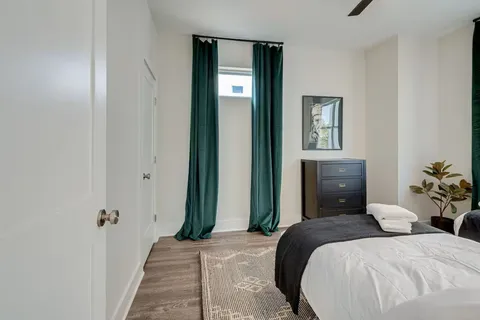 a bathroom with a double vanity sink a mirror a vanity and window