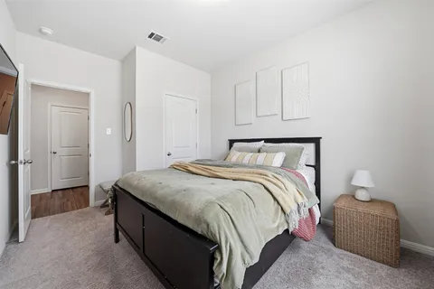 a bedroom with a bed and a cabinets
