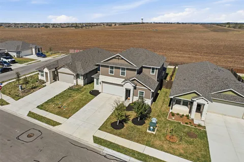 an aerial view of a house with lake view