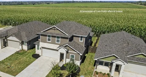 an aerial view of a house with a garden