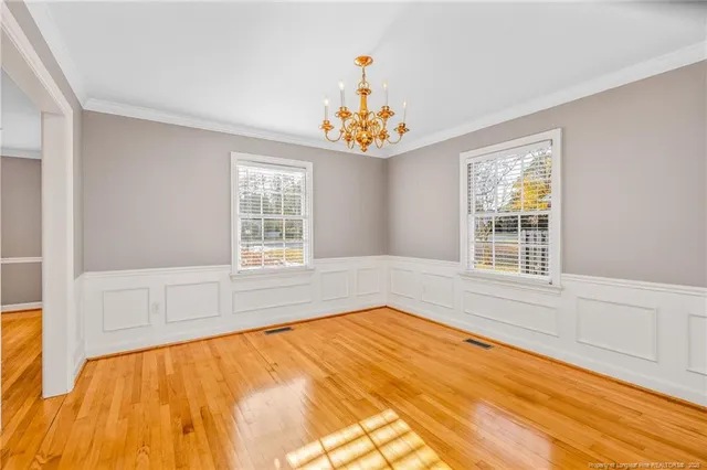 a spacious bedroom with a large bed and a window