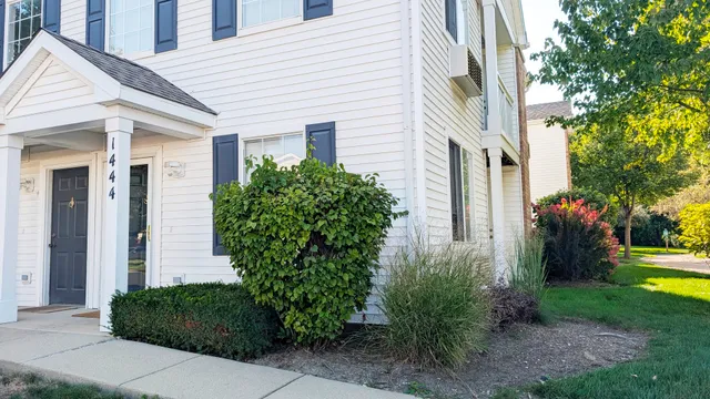a front view of a house with garden