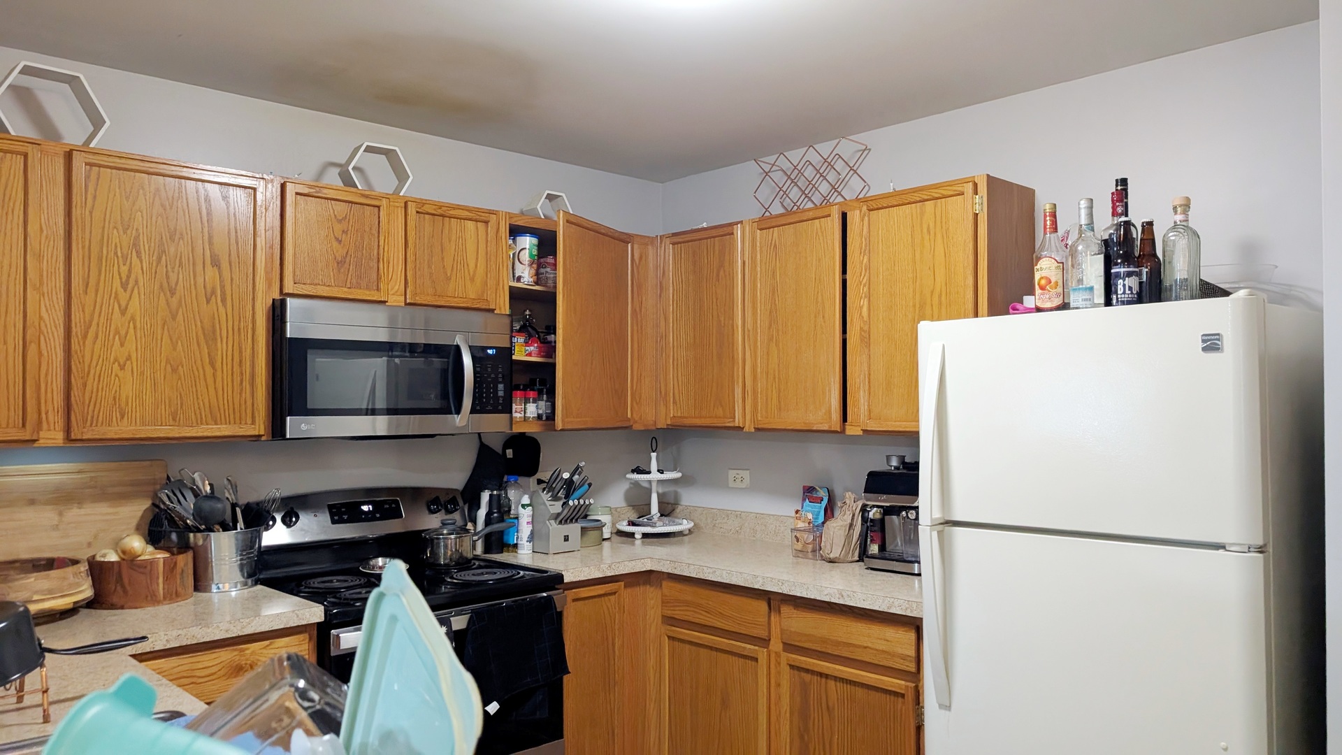 1444 McClure Road, Unit 1444 Aurora, IL 60505 - Photo 2 of 8 a kitchen with a refrigerator a stove top oven a sink and dishwasher