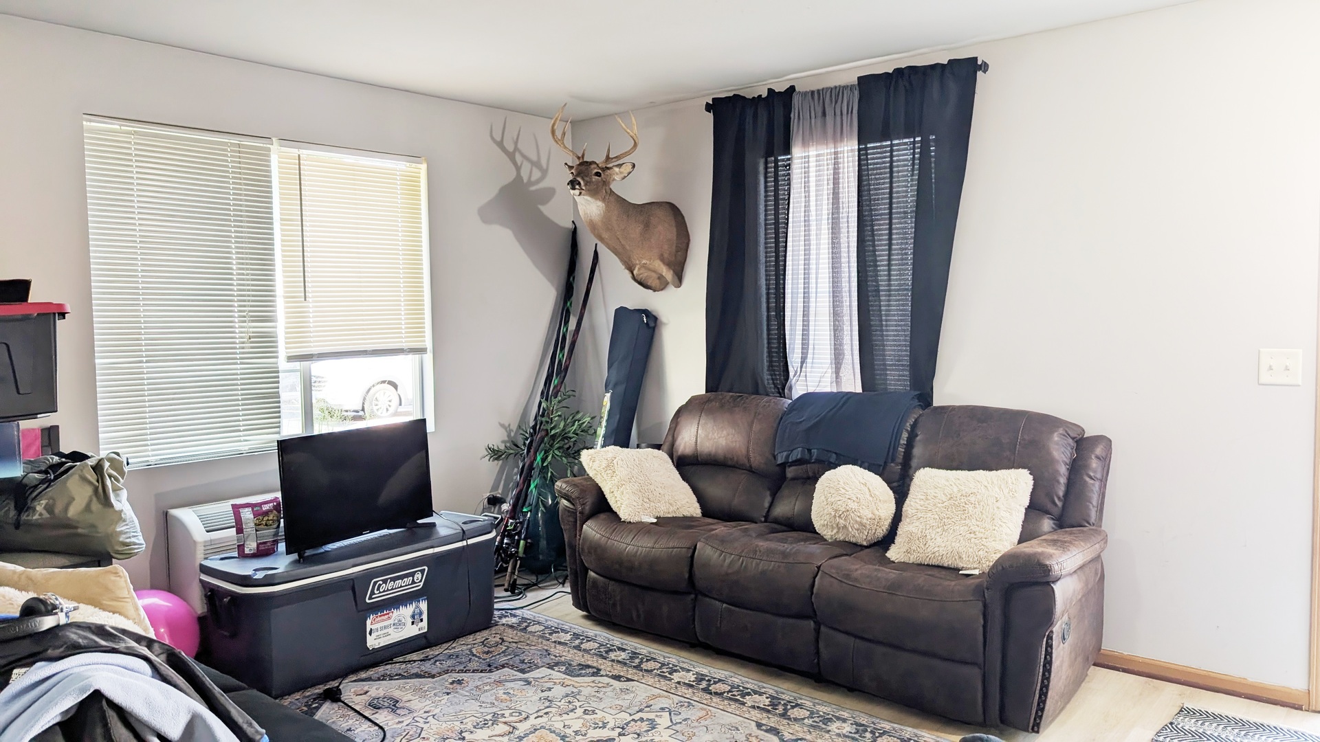 1444 McClure Road, Unit 1444 Aurora, IL 60505 - Photo 4 of 8 a living room with furniture a window and a flat screen tv