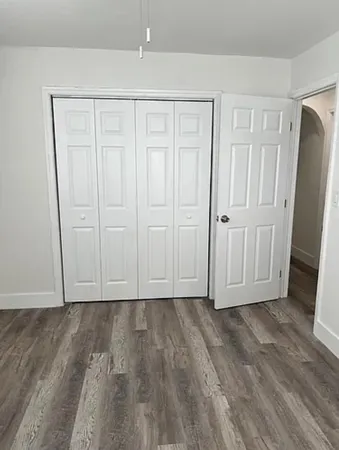 a view of room with hardwood floor