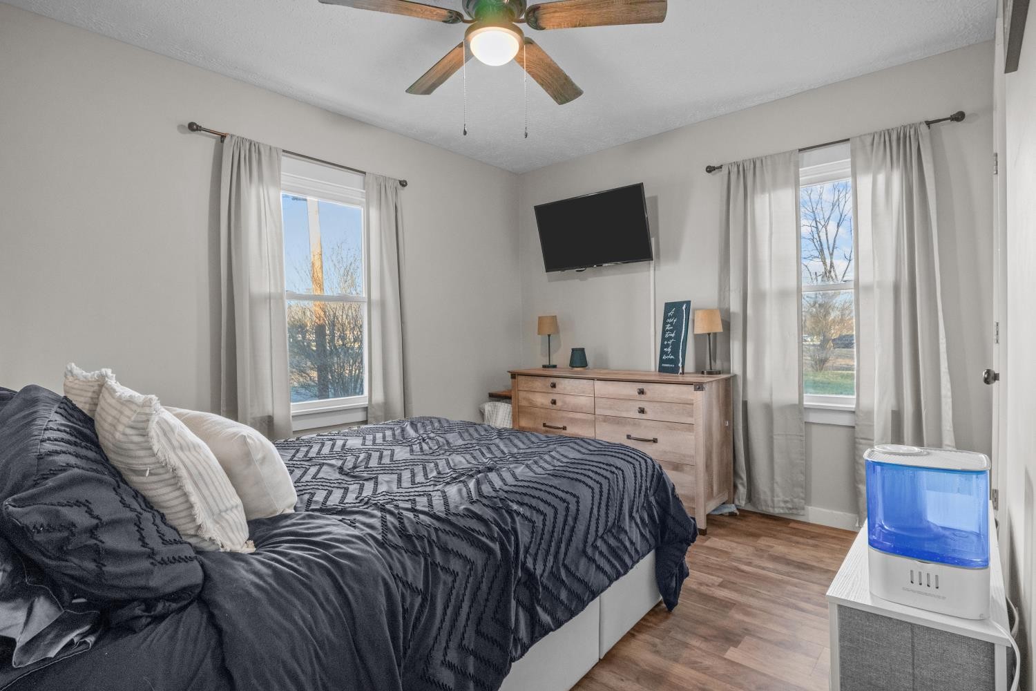 206 Joe Street Waverly, TN 37185 - Photo 11 of 28 a bedroom with a bed and a flat screen tv