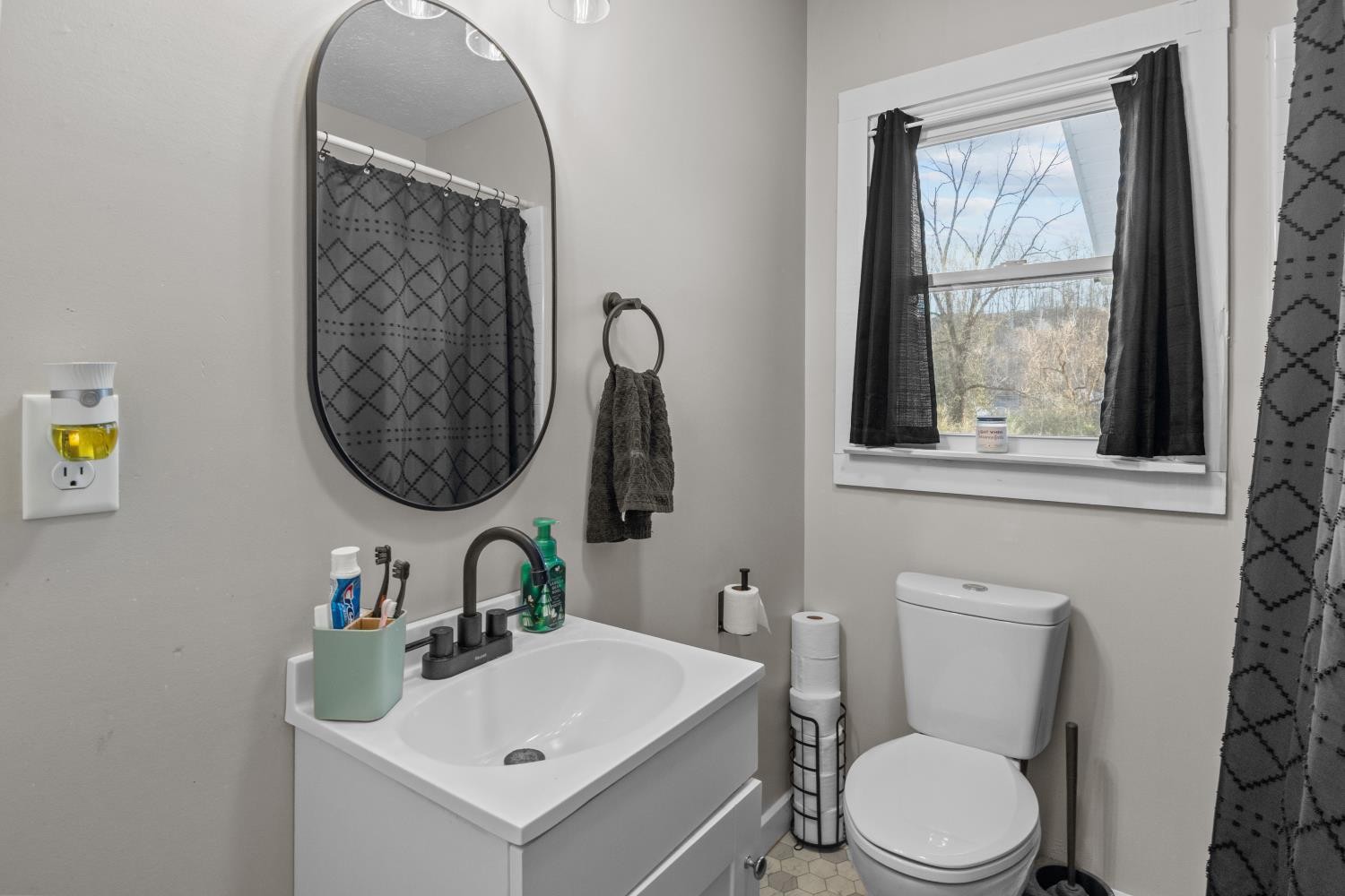 206 Joe Street Waverly, TN 37185 - Photo 13 of 28 a bathroom with a toilet sink and mirror