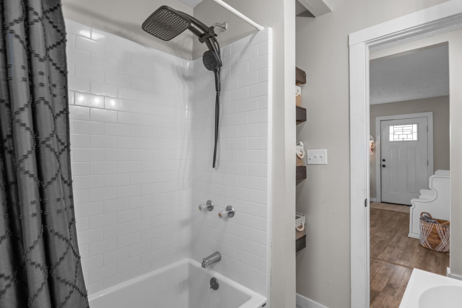 206 Joe Street Waverly, TN 37185 - Photo 14 of 28 a bathroom with a bathtub and a shower