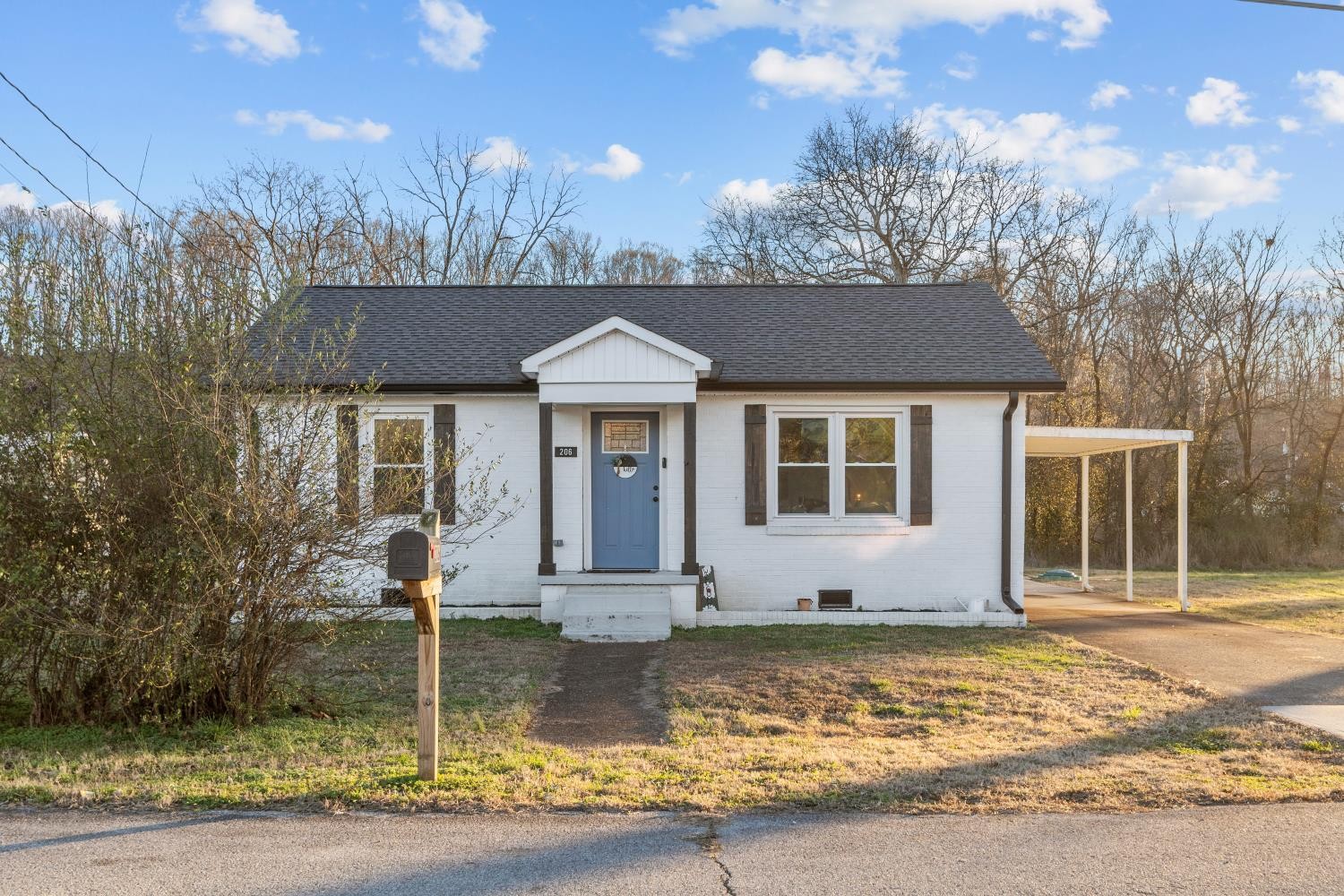 206 Joe Street Waverly, TN 37185 - Photo 27 of 28 a front view of a house with garden