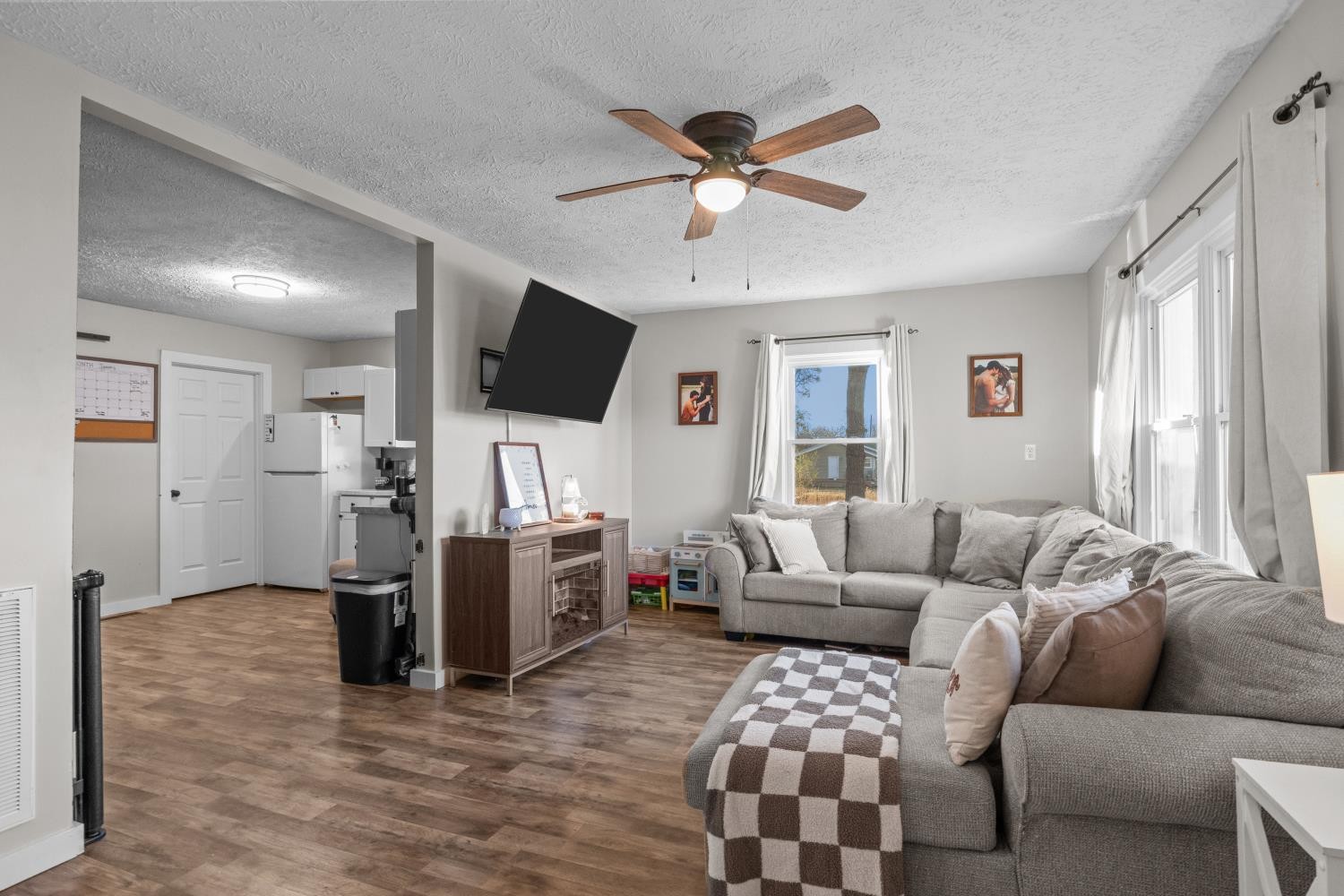 206 Joe Street Waverly, TN 37185 - Photo 5 of 28 a living room with furniture and a flat screen tv