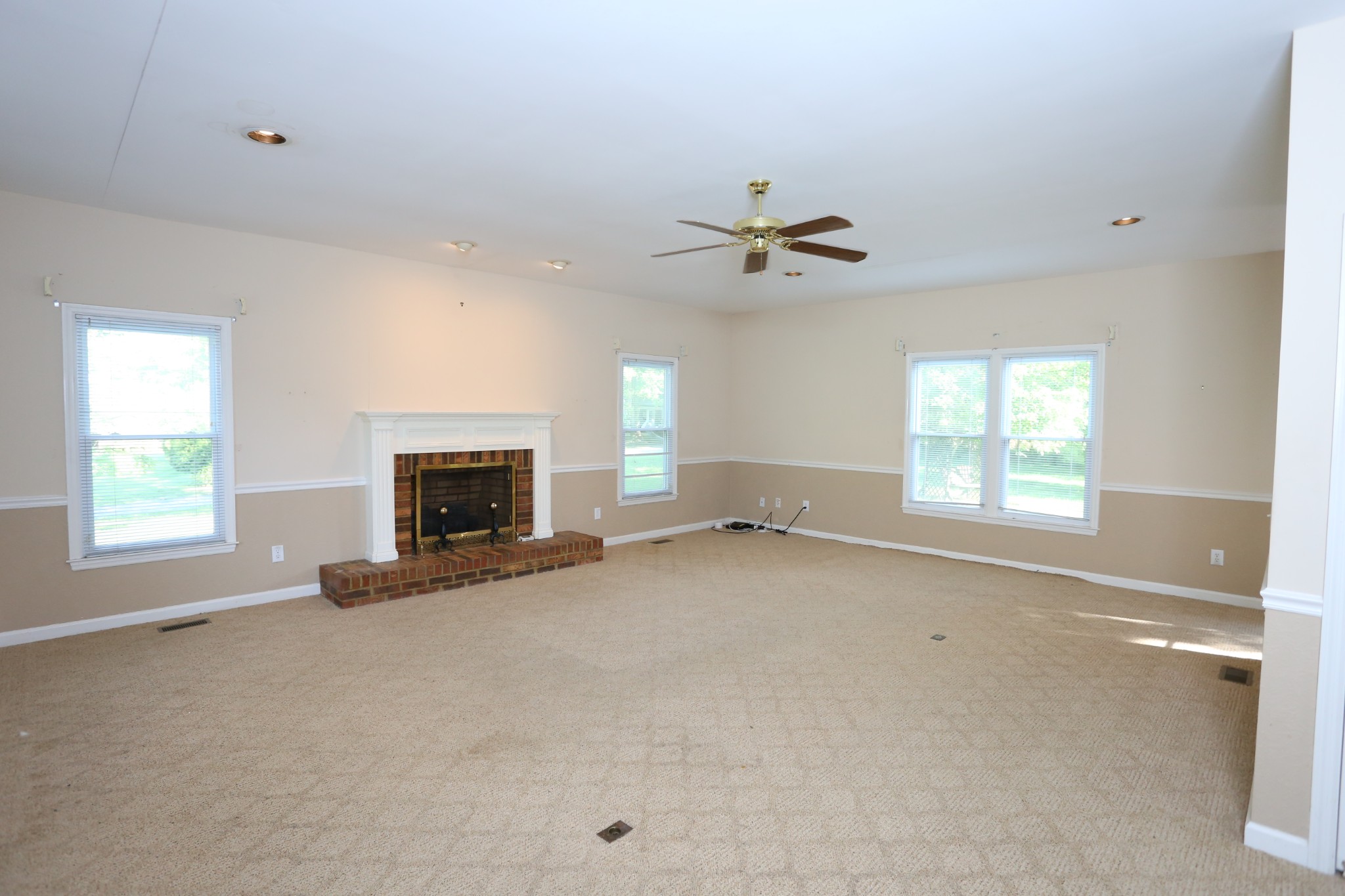 4026 Windland Drive Springfield, TN 37172 - Photo 12 of 48 an empty room with windows and fireplace