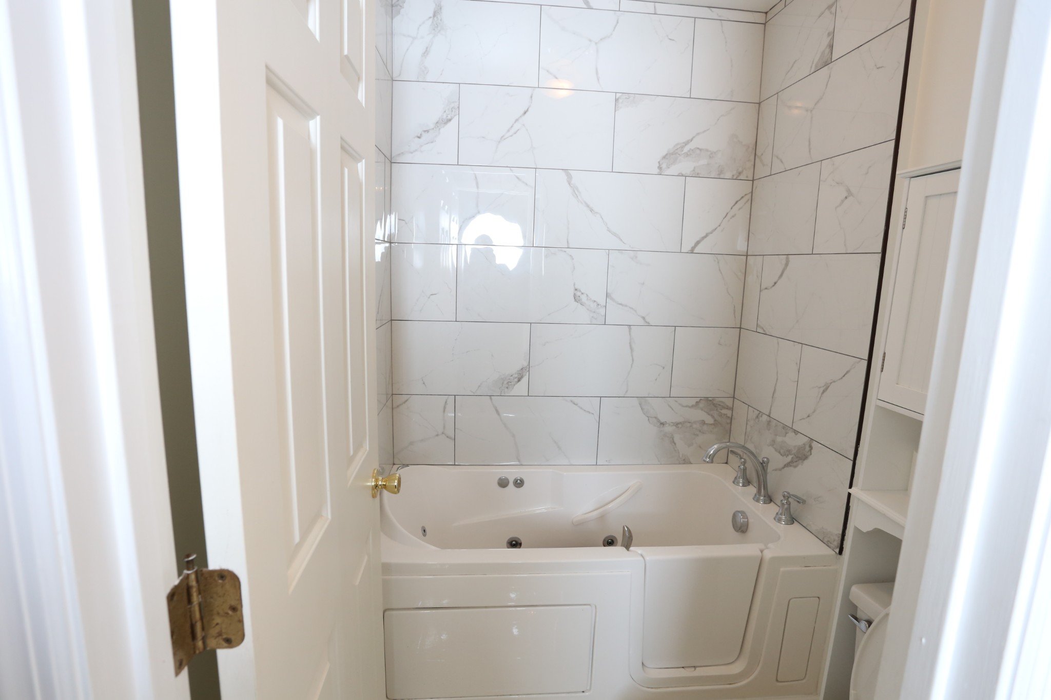 4026 Windland Drive Springfield, TN 37172 - Photo 39 of 48 a bath tub sitting next to a white sink and a shower