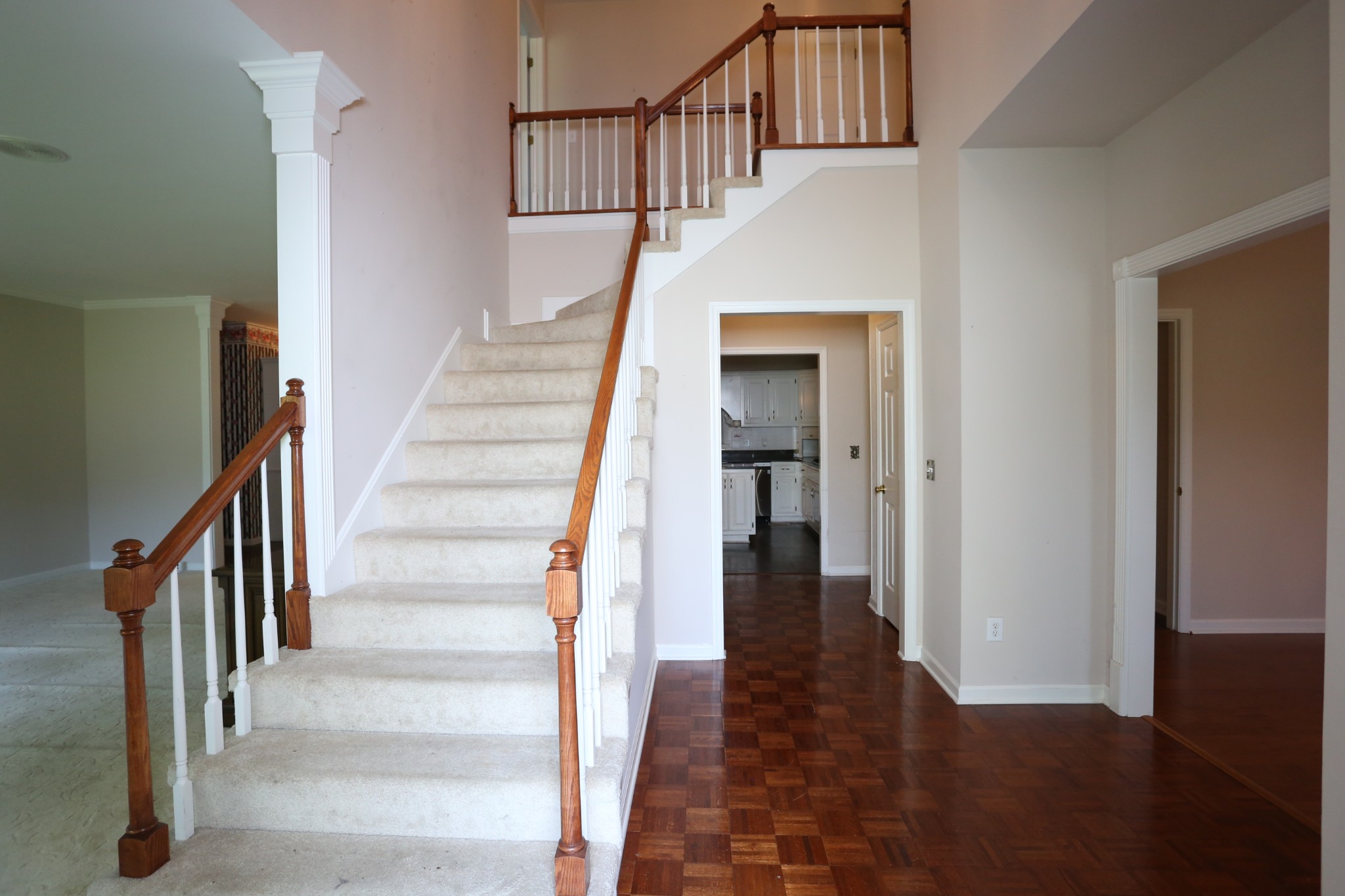 4026 Windland Drive Springfield, TN 37172 - Photo 8 of 48 a view of staircase with wooden floor and a kitchen