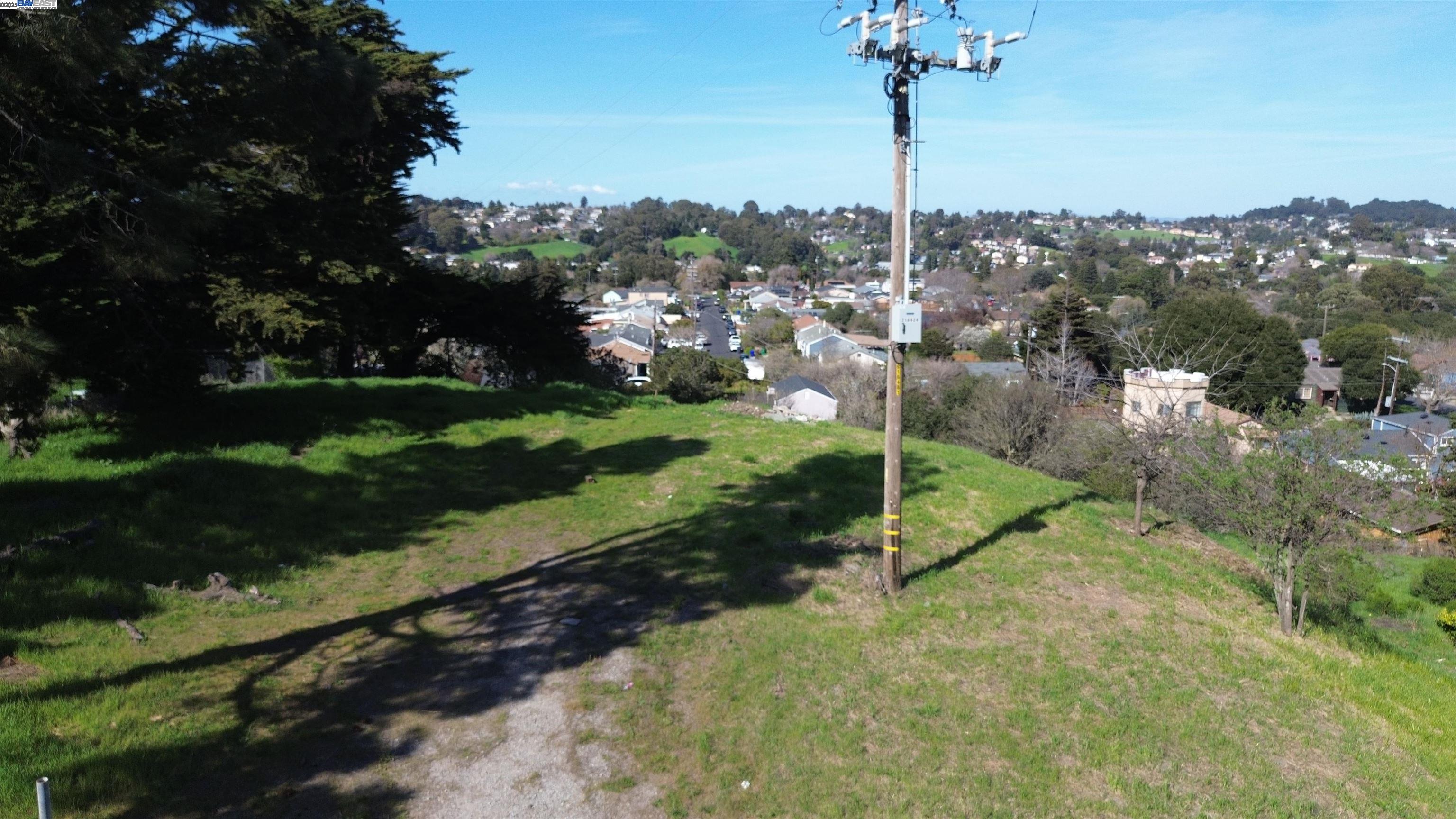 3944 La Cima Road El Sobrante, CA 94803 - Photo 27 of 35 a view of a street with a yard and a large tree