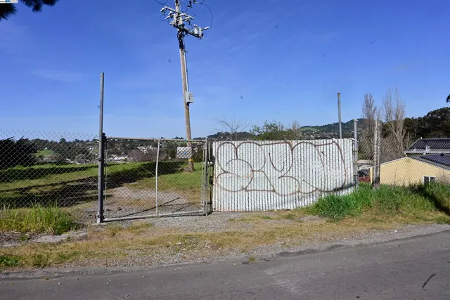 a view of a park with a sign board