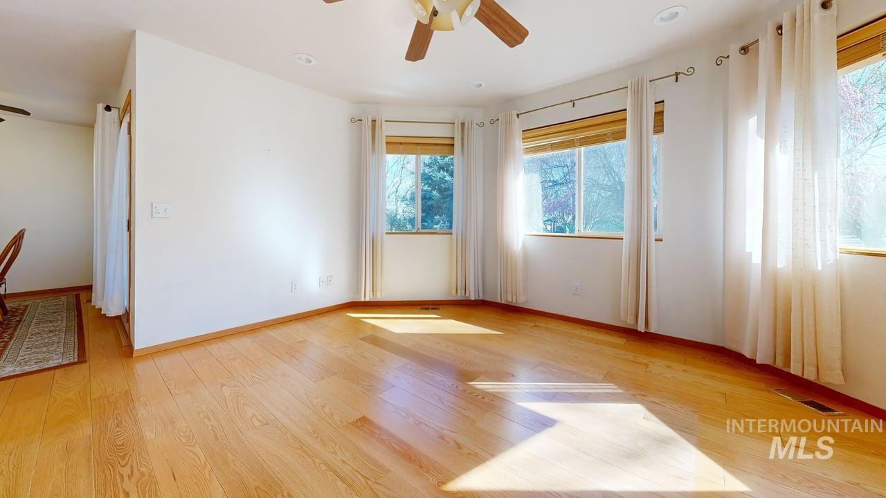 2794 9th Avenue Clarkston, WA 99403 - Photo 12 of 34 Spare room with a ceiling fan, light wood-style flooring, and plenty of natural light