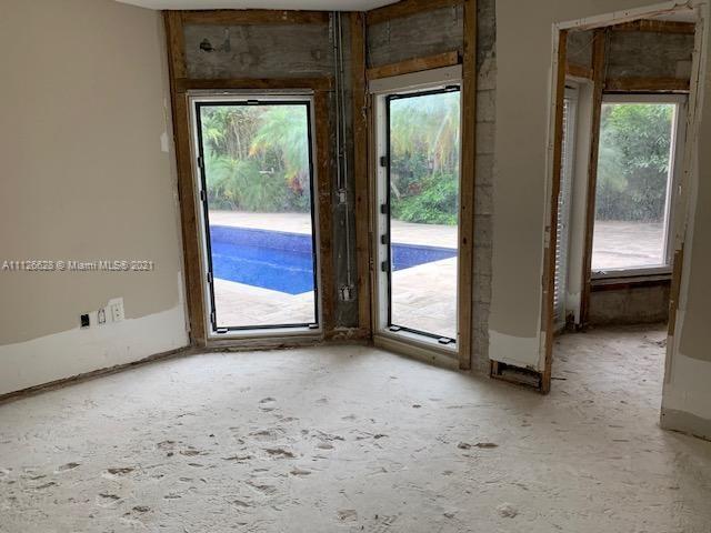 323 Caribbean Road Key Biscayne, FL 33149 - Photo 14 of 20 a view of an empty room with a window
