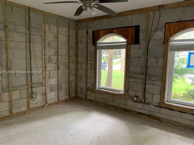 323 Caribbean Road Key Biscayne, FL 33149 - Photo 15 of 20 a view of an empty room with a window