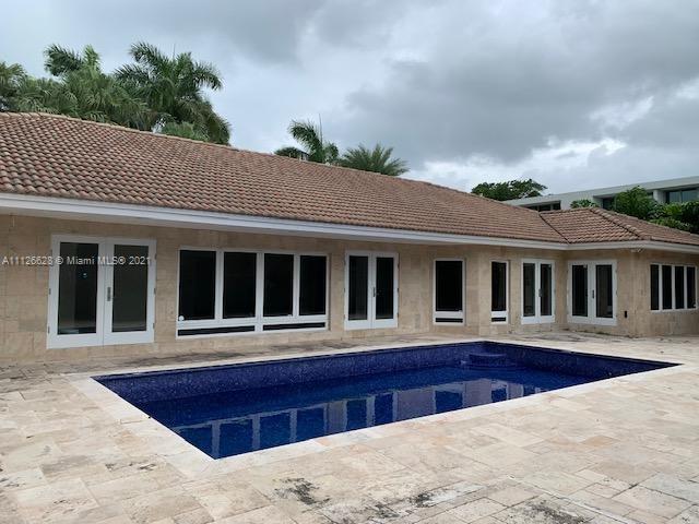 323 Caribbean Road Key Biscayne, FL 33149 - Photo 20 of 20 a front view of a house with a yard