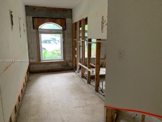 323 Caribbean Road Key Biscayne, FL 33149 - Photo 6 of 20 an empty room with windows