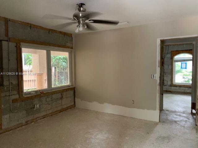 323 Caribbean Road Key Biscayne, FL 33149 - Photo 10 of 20 a view of an empty room with a window