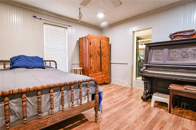 a bedroom with two beds and a dresser