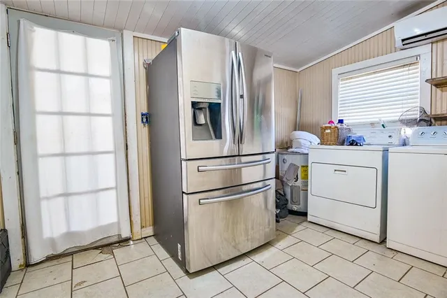 a kitchen with appliances cabinets and furniture