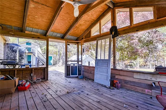 a view of living room with furniture and wooden floor