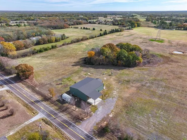 an aerial view of a house with a outdoor space