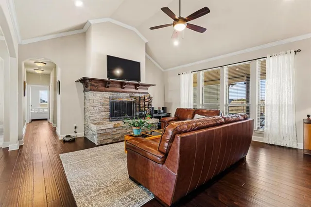 a kitchen with a stove sink and cabinets