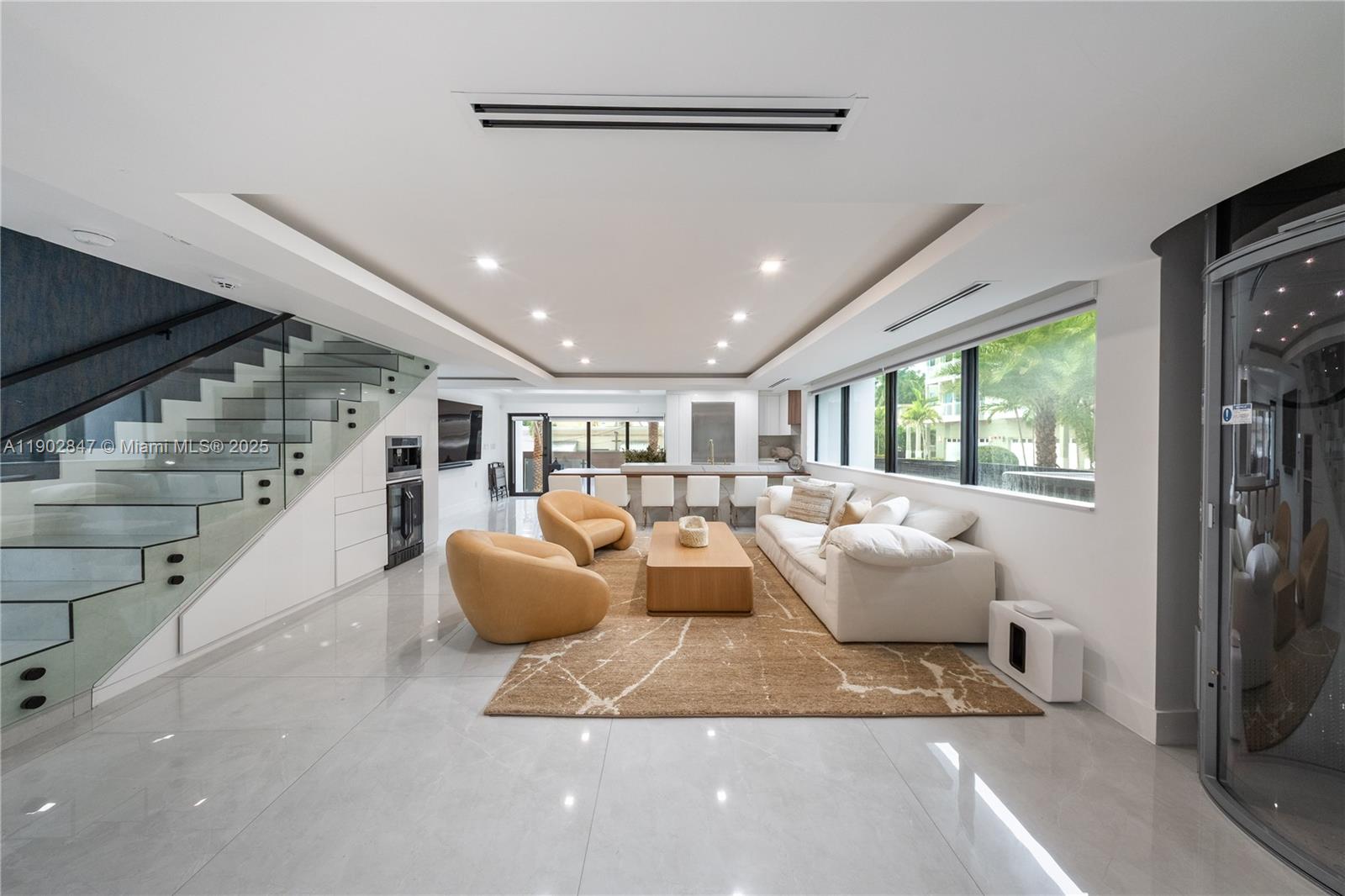 5601 North Ocean Drive Hollywood, FL 33019 - Photo 12 of 78 a living room with furniture and large windows