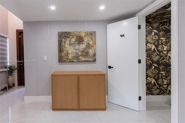 a spacious bedroom with a bed and a window