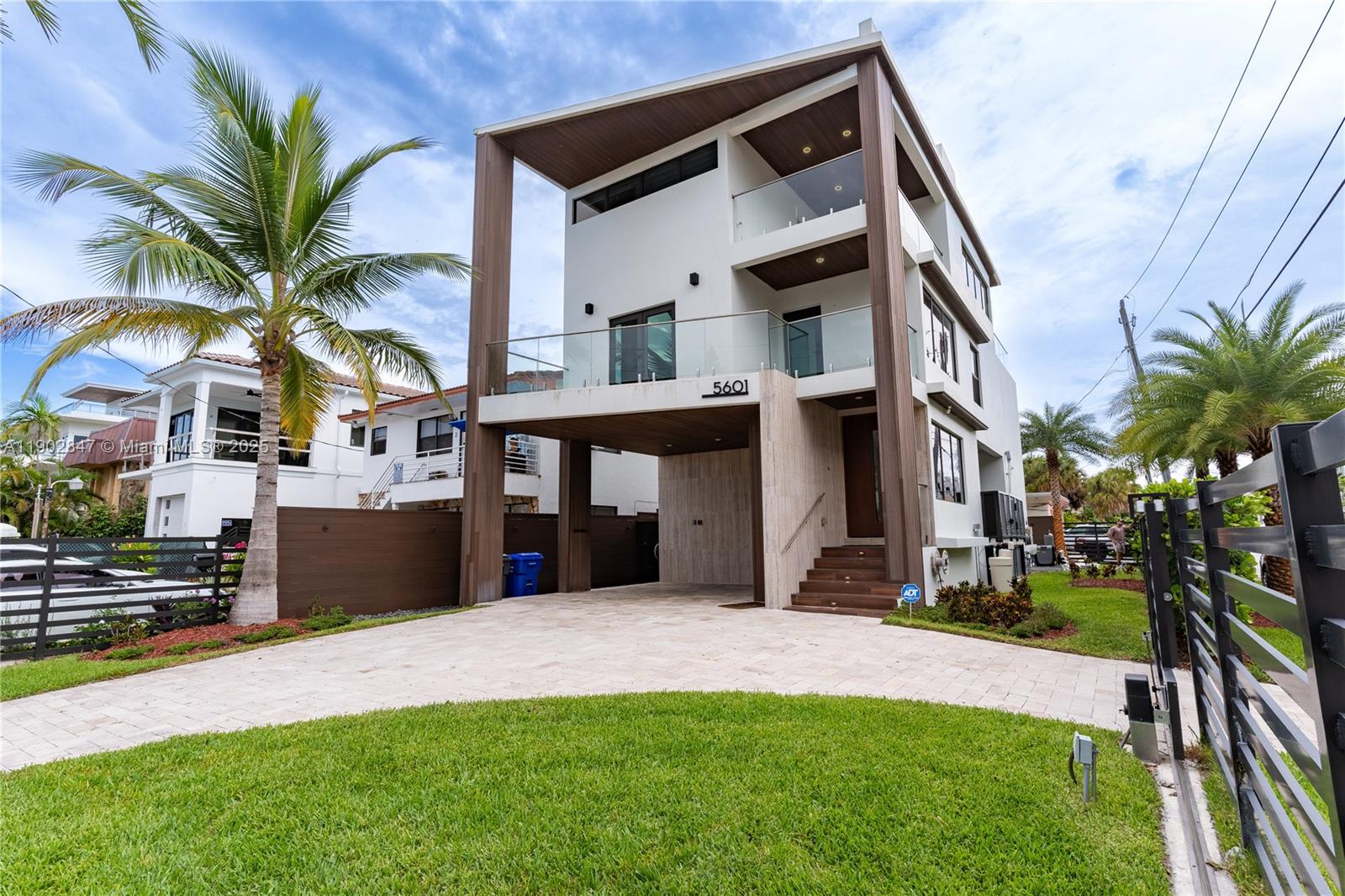 5601 North Ocean Drive Hollywood, FL 33019 - Photo 2 of 78 a front view of a house with a yard