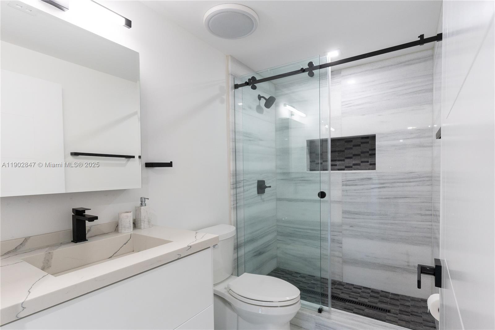 5601 North Ocean Drive Hollywood, FL 33019 - Photo 25 of 78 a bathroom with a sink toilet and shower