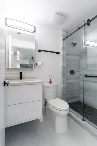 a spacious bedroom with a large bed and a couch