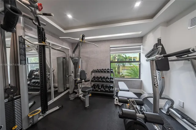 a bedroom with a bed and glass door