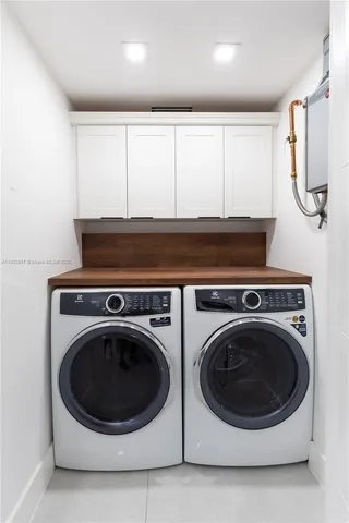 a bathroom with a toilet and a shower curtain