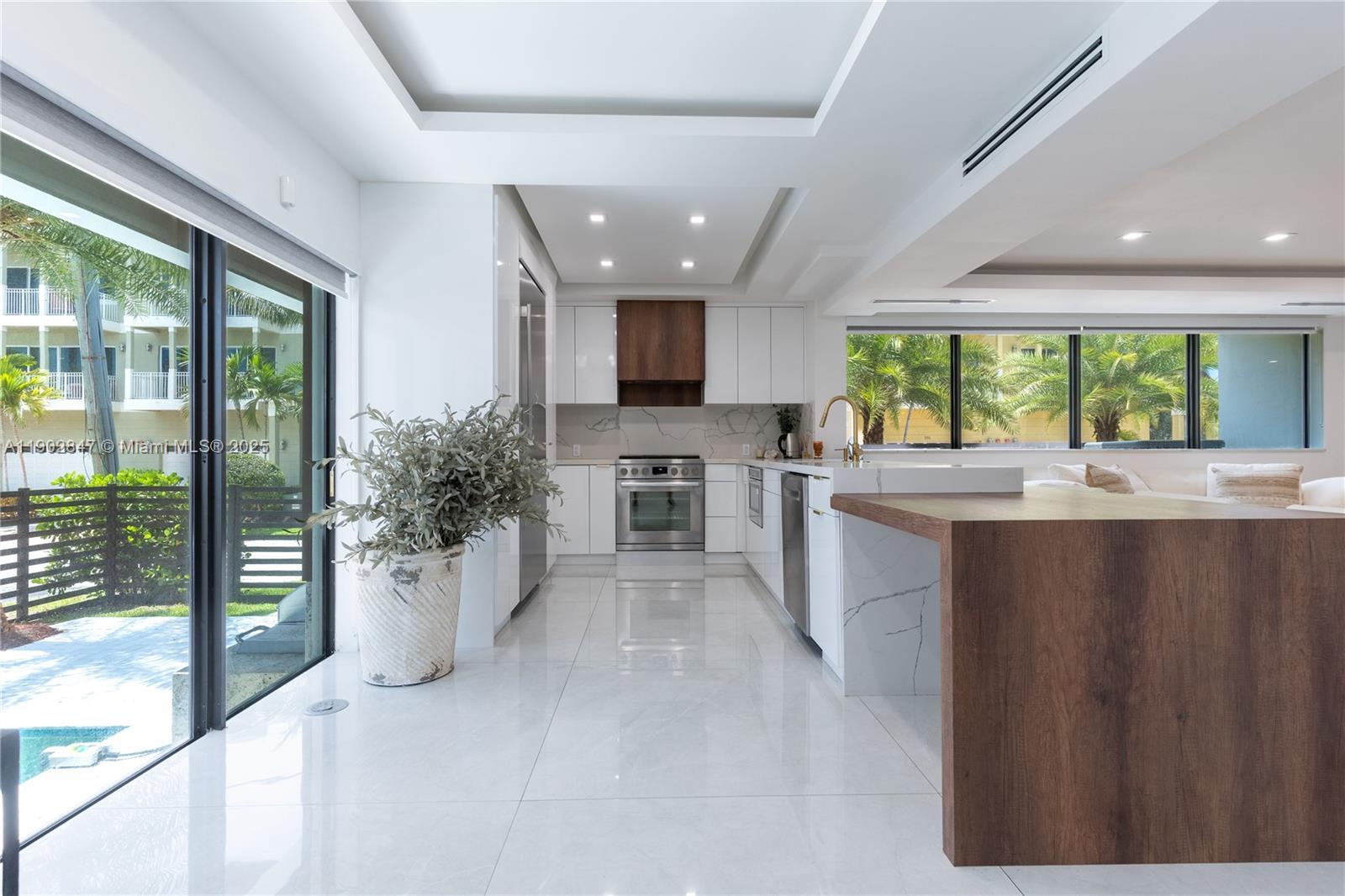 5601 North Ocean Drive Hollywood, FL 33019 - Photo 4 of 78 a large white kitchen with a large window